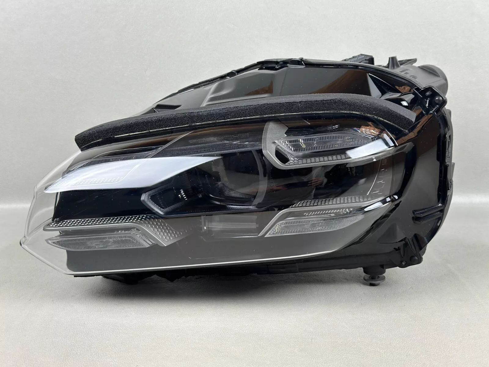 Mint condition 2020-2023 Porsche Taycan left driver side LED OEM headlight, perfect for replacement, available at Auto-Headlights.com, a trusted online shop in the USA.